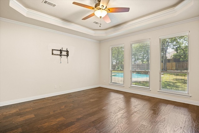 3600 Big Timber Ln, Granbury, TX 76049 - empty room with a raised ceiling, ornamental molding, dark wood-type flooring, ceiling fan, and baseboards
