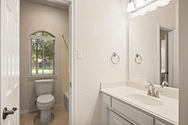 3600 Big Timber Ln, Granbury, TX 76049 - bathroom with vanity, toilet, shower / washtub combination, and a textured wall
