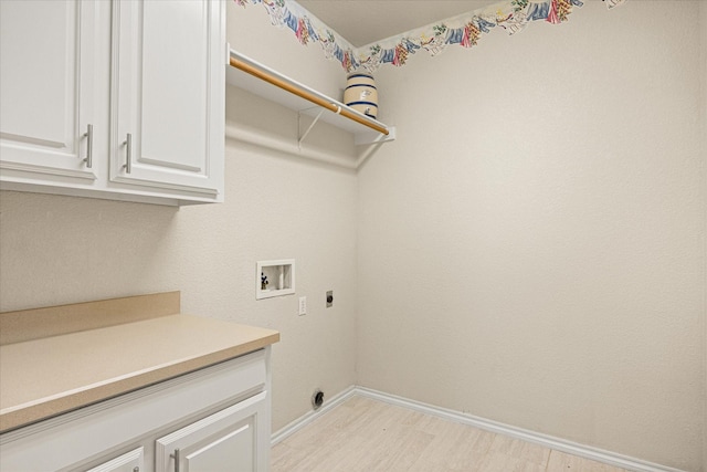 3600 Big Timber Ln, Granbury, TX 76049 - laundry room with hookup for a washing machine, hookup for an electric dryer, light wood-type flooring, cabinet space, and baseboards