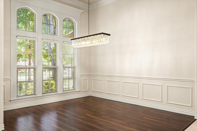 3600 Big Timber Ln, Granbury, TX 76049 - spare room with a chandelier, dark wood-style floors, ornamental molding, and a decorative wall