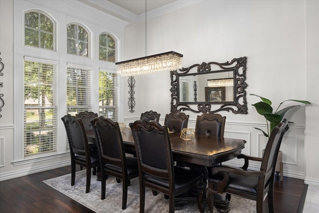 3600 Big Timber Ln, Granbury, TX 76049 - dining space with a chandelier, crown molding, wood finished floors, and a decorative wall