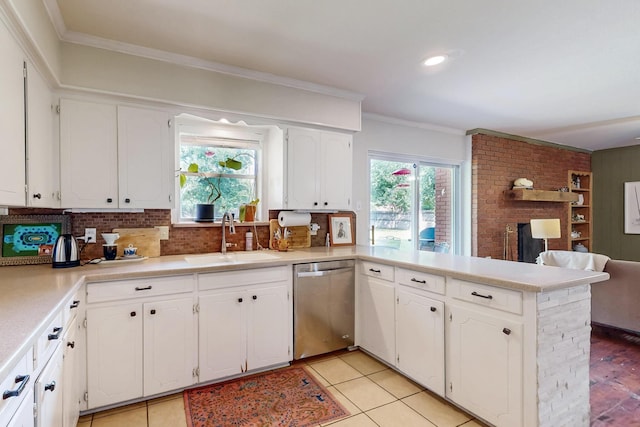 204 Cacti Dr, Lakeside, TX 76108 - kitchen featuring stainless steel dishwasher, a sink, white cabinets, a peninsula, and backsplash