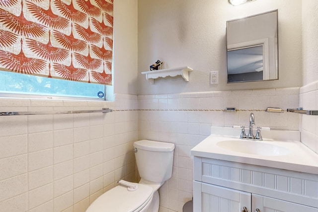 204 Cacti Dr, Lakeside, TX 76108 - half bathroom with toilet, vanity, tile walls, and a wainscoted wall