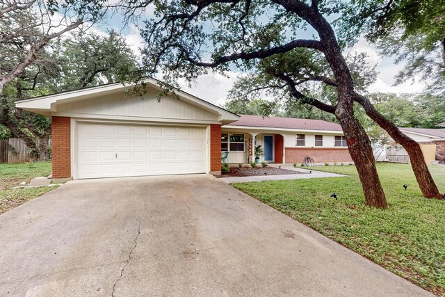 204 Cacti Dr, Lakeside, TX 76108 - ranch-style home featuring brick siding, concrete driveway, and an attached garage