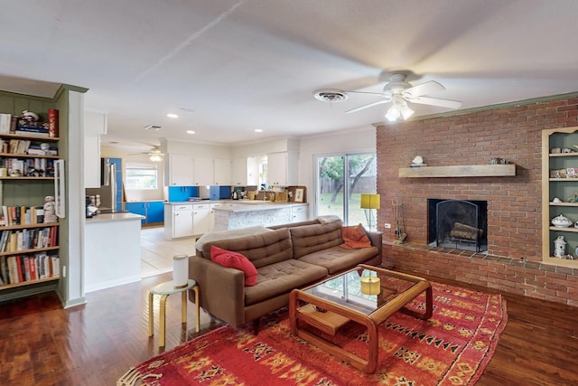 204 Cacti Dr, Lakeside, TX 76108 - living room with ceiling fan, ornamental molding, healthy amount of natural light, and wood finished floors