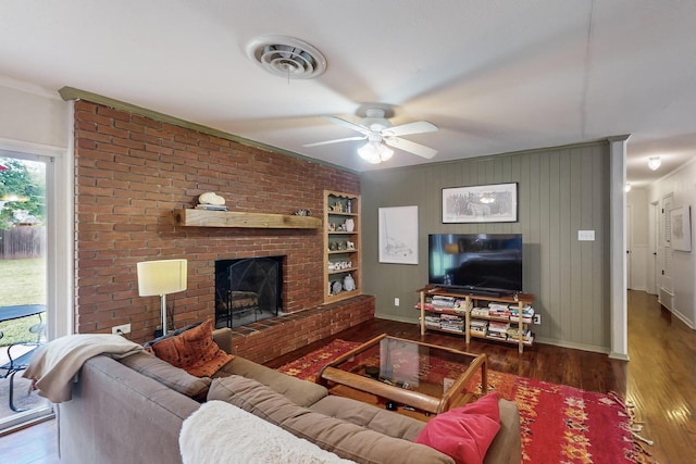 204 Cacti Dr, Lakeside, TX 76108 - living area featuring wood finished floors, a ceiling fan, baseboards, a fireplace, and crown molding