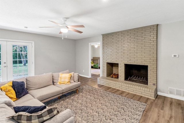 2808 Wren Ave, Fort Worth, TX 76133 - living area featuring ceiling fan, wood finished floors, baseboards, and a brick fireplace