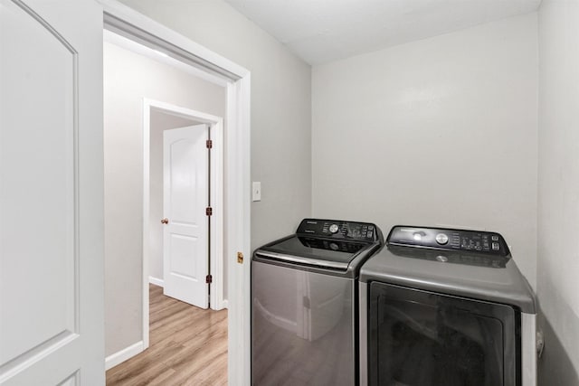 2808 Wren Ave, Fort Worth, TX 76133 - laundry area with separate washer and dryer, light wood-style floors, and baseboards