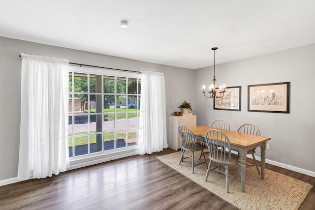 2808 Wren Ave, Fort Worth, TX 76133 - dining area with a chandelier, dark wood-style floors, and baseboards