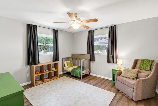 2808 Wren Ave, Fort Worth, TX 76133 - bedroom with wood finished floors, baseboards, and a ceiling fan