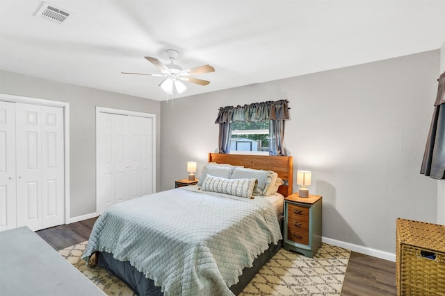 2808 Wren Ave, Fort Worth, TX 76133 - bedroom featuring baseboards, wood finished floors, two closets, and a ceiling fan