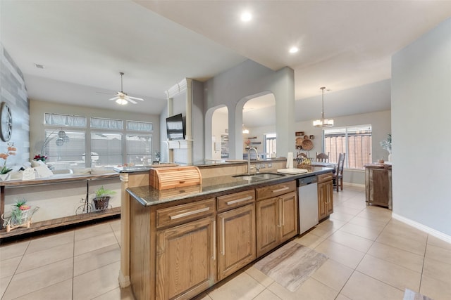 3113 Summer Dr, Little Elm, TX 75068 - kitchen featuring a sink, dishwasher, arched walkways, ceiling fan, and light tile patterned flooring