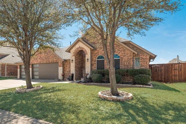 3113 Summer Dr, Little Elm, TX 75068 - view of front of house with brick siding, a garage, driveway, and a shingled roof