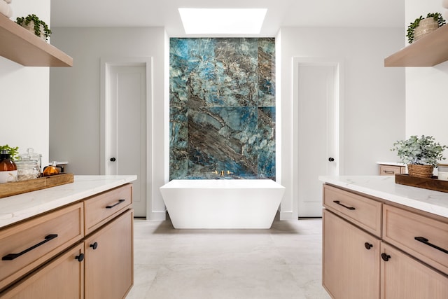 13845 Peyton Dr, Dallas, TX 75240 - full bathroom featuring a skylight, a freestanding tub, and vanity