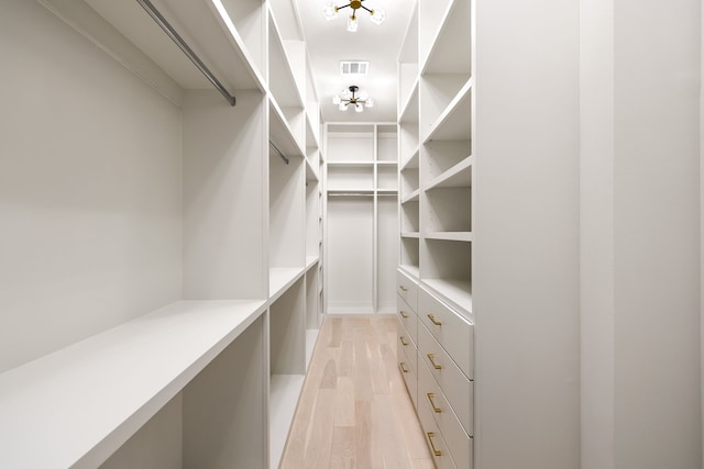 13845 Peyton Dr, Dallas, TX 75240 - walk in closet with light wood finished floors