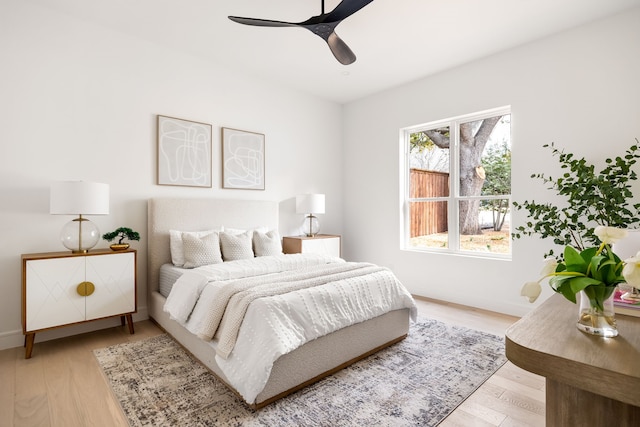 13845 Peyton Dr, Dallas, TX 75240 - bedroom with light wood-style floors, baseboards, and ceiling fan