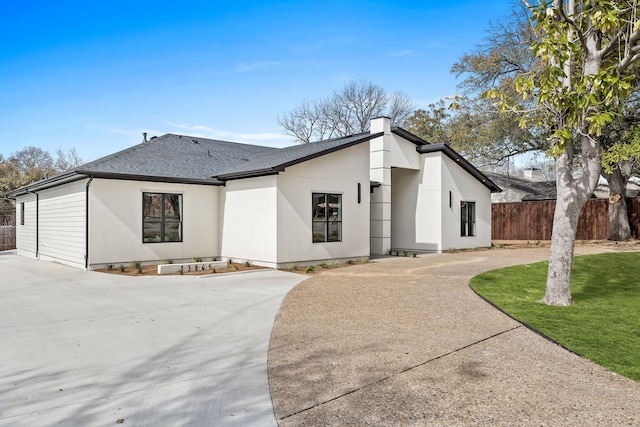 13845 Peyton Dr, Dallas, TX 75240 - view of front of home featuring a shingled roof and concrete driveway