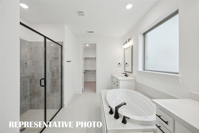 4180 Kestrel St, Prosper, TX 75078 - full bathroom featuring a shower stall, a garden tub, vanity, recessed lighting, and a spacious closet