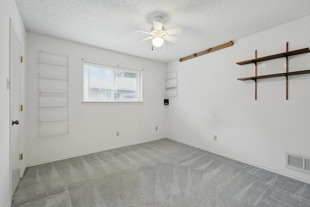 220 Simmons Dr, Coppell, TX 75019 - spare room with a textured ceiling, a ceiling fan, carpet, and baseboards