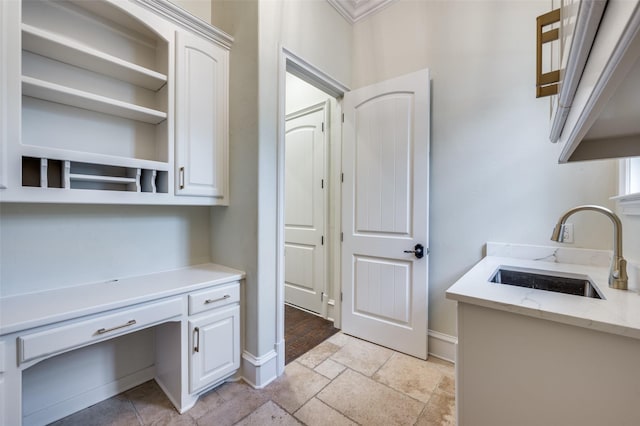 4012 Colgate Ave, University Park, TX 75225 - kitchen with a sink, white cabinets, light stone countertops, and open shelves
