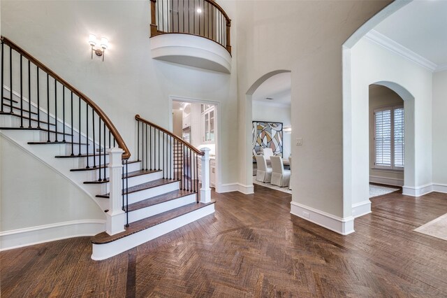 4012 Colgate Ave, University Park, TX 75225 - foyer entrance with ornamental molding, a high ceiling, stairway, baseboards, and wood finished floors