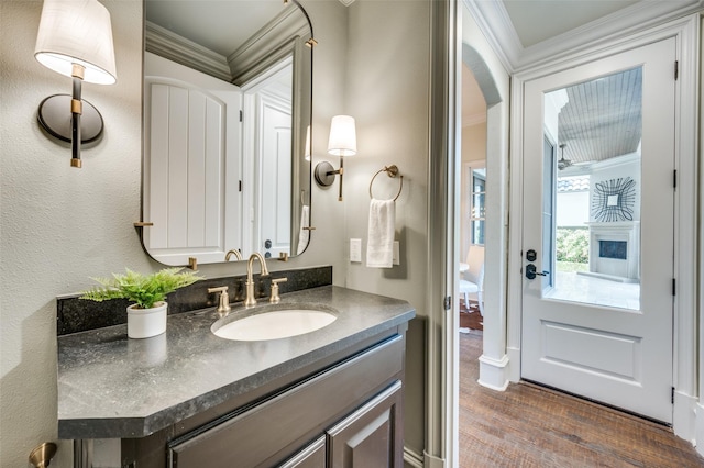 4012 Colgate Ave, University Park, TX 75225 - bathroom with vanity, ornamental molding, and wood finished floors