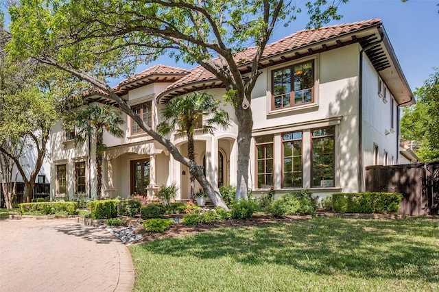4012 Colgate Ave, University Park, TX 75225 - mediterranean / spanish-style home featuring a tile roof and stucco siding