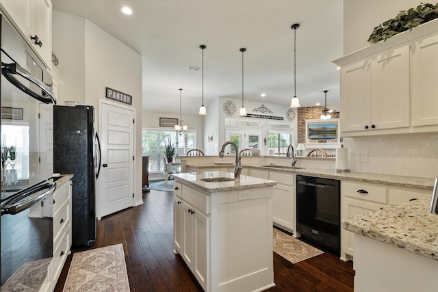768 Northside Dr, Pilot Point, TX 76258 - kitchen with black appliances, a sink, tasteful backsplash, recessed lighting, and dark wood-style flooring