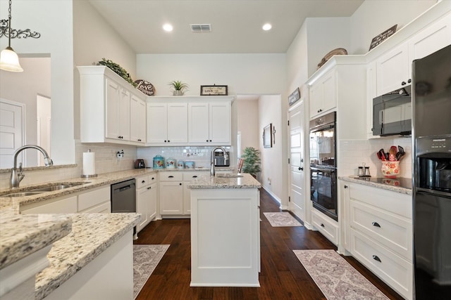 768 Northside Dr, Pilot Point, TX 76258 - kitchen featuring a sink, black appliances, decorative backsplash, light stone countertops, and recessed lighting