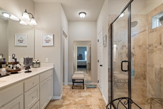 768 Northside Dr, Pilot Point, TX 76258 - ensuite bathroom featuring double vanity, a stall shower, and baseboards
