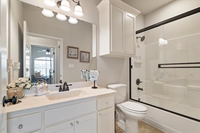 768 Northside Dr, Pilot Point, TX 76258 - bathroom featuring vanity, toilet, combined bath / shower with glass door, and ceiling fan