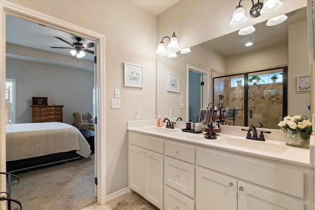 768 Northside Dr, Pilot Point, TX 76258 - ensuite bathroom featuring double vanity, a stall shower, a ceiling fan, and baseboards