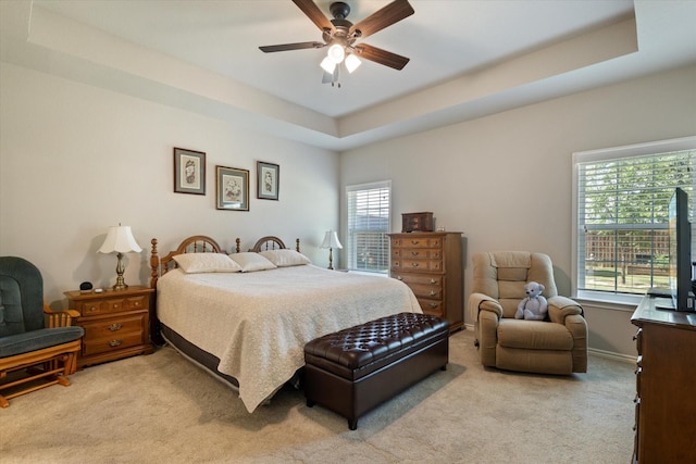 768 Northside Dr, Pilot Point, TX 76258 - bedroom featuring light colored carpet, a raised ceiling, ceiling fan, and baseboards