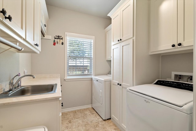 768 Northside Dr, Pilot Point, TX 76258 - washroom featuring cabinet space, independent washer and dryer, and baseboards