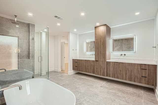 16212 Spring Creek Rd, Dallas, TX 75248 - full bathroom featuring a shower stall, double vanity, a soaking tub, and recessed lighting