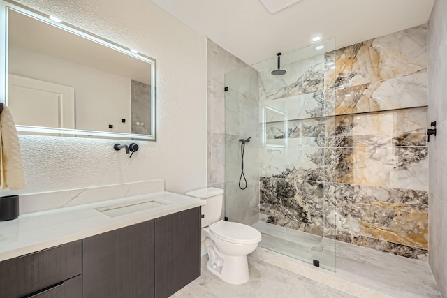 16212 Spring Creek Rd, Dallas, TX 75248 - bathroom with toilet, vanity, a walk in shower, and a textured wall