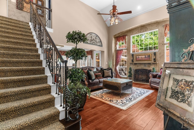 7904 Linksview Dr, Mckinney, TX 75072 - living area with stairway, crown molding, wood finished floors, a multi sided fireplace, and ceiling fan