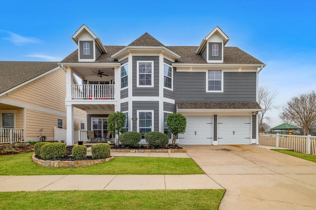 1400 Mountain Laurel Dr, Savannah, TX 76227 - view of front of home featuring a balcony, roof with shingles, driveway, a garage, and a ceiling fan