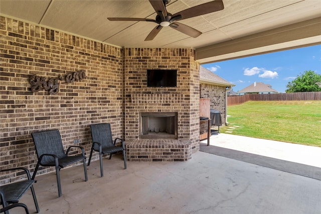 110 Oak View Dr, Godley, TX 76044 - view of patio / terrace featuring an outdoor brick fireplace and a ceiling fan