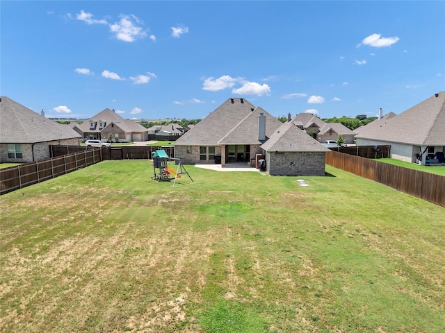 110 Oak View Dr, Godley, TX 76044 - back of property featuring a patio area, a residential view, and brick siding