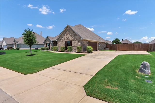 110 Oak View Dr, Godley, TX 76044 - view of front facade featuring concrete driveway, an attached garage, brick siding, and roof with shingles