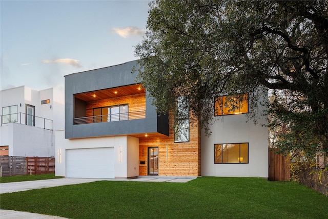 3940 N Cresthaven, Dallas, TX 75209 - view of front facade featuring a garage, a balcony, stucco siding, and driveway
