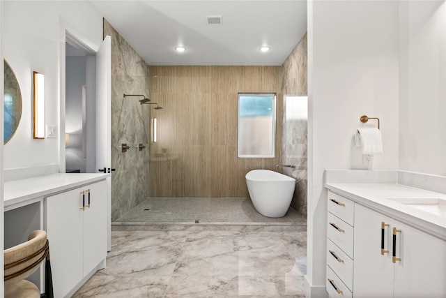 3940 N Cresthaven, Dallas, TX 75209 - full bathroom featuring vanity, a walk in shower, a freestanding tub, and marble finish flooring