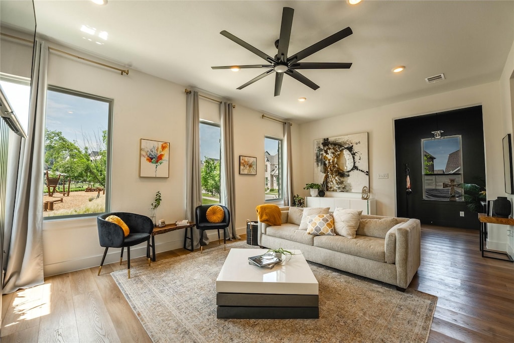 5215 Mareliz Ln, Sachse, TX 75048 - living room with wood finished floors, recessed lighting, ceiling fan, and baseboards