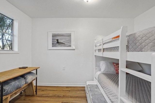 4504 Hodgkins Rd, Lake Worth, TX 76135 - bedroom featuring wood finished floors and baseboards