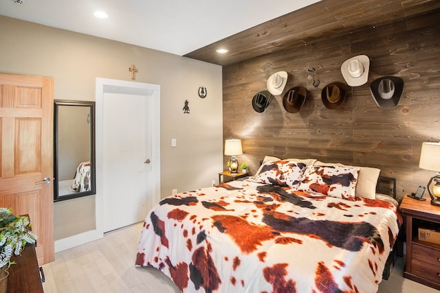 1430 Rs County Road 1605, Point, TX 75472 - bedroom with recessed lighting, light wood-style flooring, wood walls, and baseboards