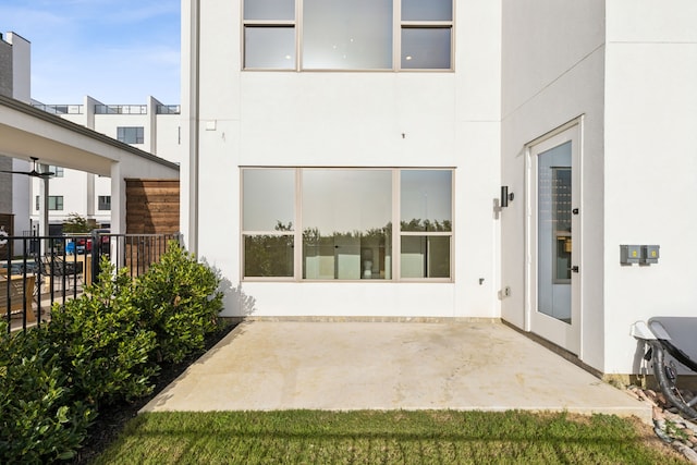 4929 Blaynes Vw, The Colony, TX 75056 - back of house with stucco siding and a patio
