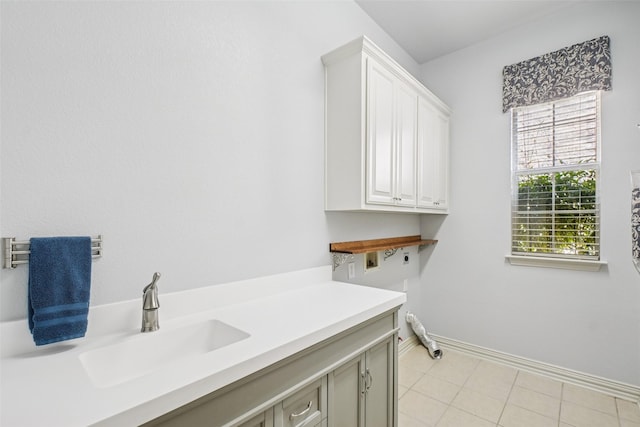 8304 Old Hickory Ln, Mckinney, TX 75072 - laundry room with hookup for an electric dryer, cabinet space, baseboards, light tile patterned floors, and washer hookup