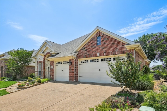 8304 Old Hickory Ln, Mckinney, TX 75072 - traditional-style home with a garage, brick siding, and concrete driveway