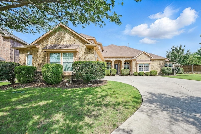 14708 Myrtle Beach Ln, Frisco, TX 75035 - view of front of home with stone siding, brick siding, and driveway